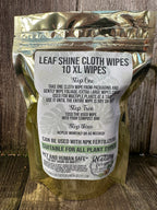 Pack of leaf shine cloth wipes on a wooden surface
